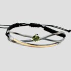 Pulsera peridoto infinito de macramé, oro y plata. Joya creada por Comin Joieria Creativa